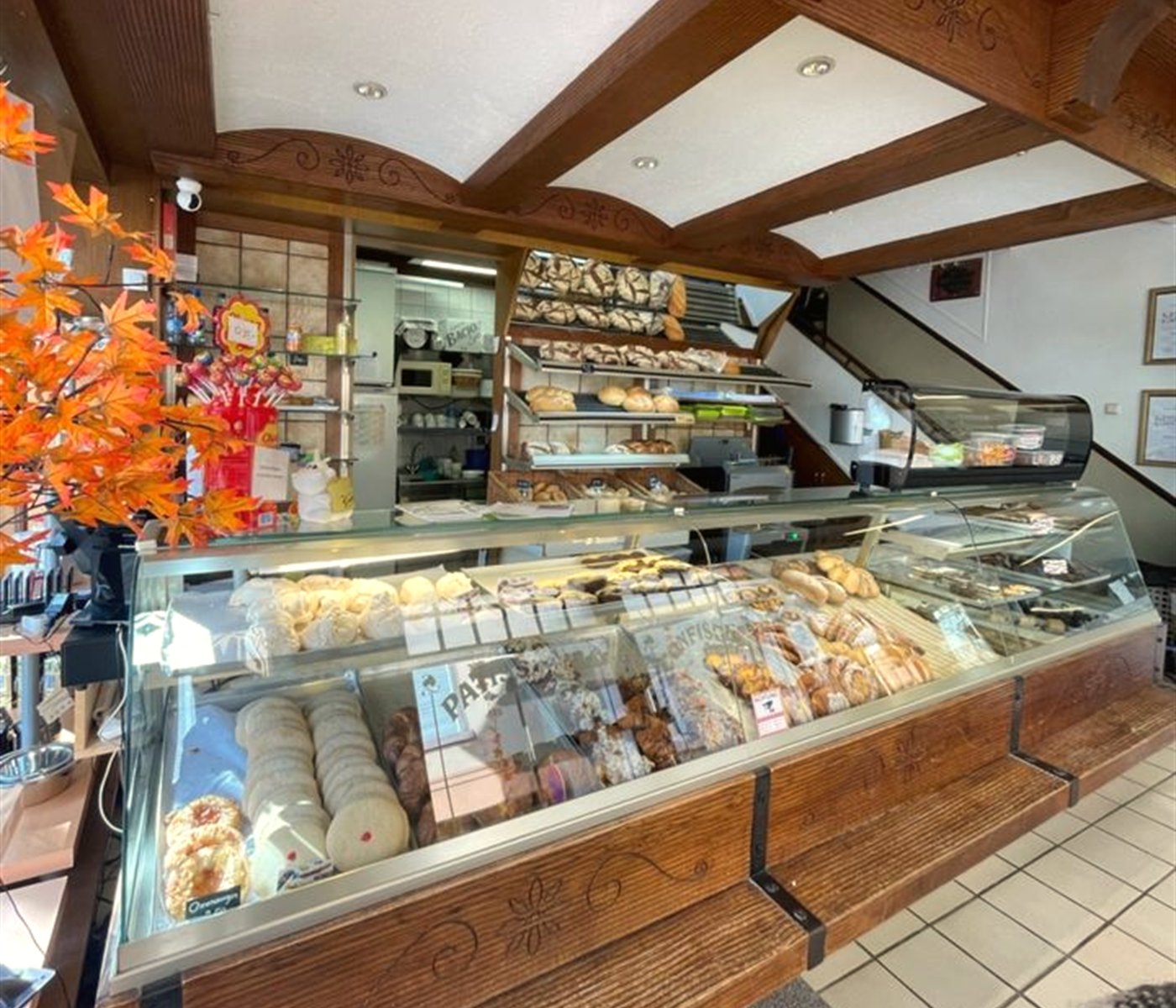 Bakery counter at Au Croissant d'Or filled with fresh bread and pastries